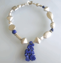 <em>Chinese Puzzle,</em> necklace, lapis lazuli, sterling silver, goldplated silver, 19 x 14 x 1.2cm, no 1511.