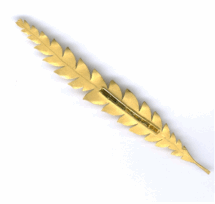 <em>Dryandra formosa -Wildflower Collection, </em>brooch, 18ct gold, natural green sapphire, 10.3 x 1.4 x 0.7cm, no 1414.