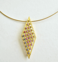 <em>Sapphire Symphony - Homage to Klimt,</em> Brooch/pendant, 18ct gold, 30 multi coloured sapphires and ruby on fine Gathman 18ct neck cable no 10a, 6.0 x 2.0 x .5 cm, no 0879.