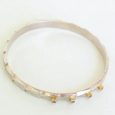 <em>For Mada - Homage to Klimt, </em>sterling silver, 18ct gold, sapphire, 0.8 x 6.5cm diameter, no 1042.