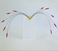 <em>Anigozanthus humilus on stand - Wildflower Collection,</em> pectoral piece, 18ct gold, red coral, stainless steel cable on acrylic stand,12 x 22 x 0.8cm, no 0757c.