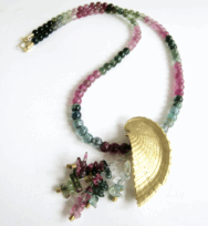 <em>Barque III - Seashore Collection, </em>Brooch/pendant, 18ct gold, steel, tourmaline chips, steel, 4.5 x 5.0 x 1.2 cm. no 0656.c1 on tourmaline strand of beads, no 1075.