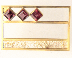 <em>Abstract Fritza - Homage to Klimt, </em>brooch, 18ct white and yellow gold, 3 rhodalite garnets, 2.5 x 4.0 x 0.7cm, no 0827.