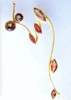 <em>A Kiss for All the World - Homage to Klimt,</em> brooch, 18ct yellow gold, 5.47 cts natural green and brown sapphires, 7.0 x 3.0 x 0.8cm, no 0926.